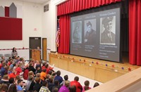 student speaking at veterans day assembly