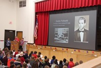 student speaking at veterans day assembly