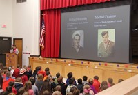 student speaking at veterans day assembly