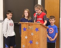 up close of student speaking at veterans day assembly