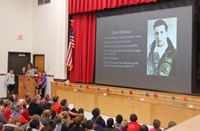 student speaking at veterans day assembly