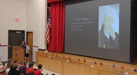 student speaking at veterans day assembly