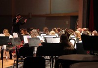 medium shot of band playing from behind stage