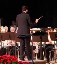 instructor conducting band students