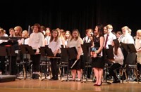 students standing after performance