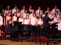 students singing on stage