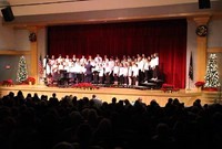 wide shot of seventh and eighth grade chorus on stage