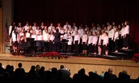 medium shot of seventh and eighth grade chorus on stage