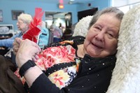 resident smiling holding ornament