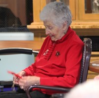 resident looking at ornament