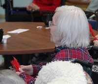 resident holding ornament