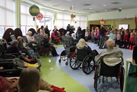 students singing for elizabeth church manor residents
