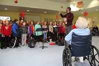 students singing for residents