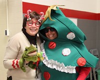 two people dressed up in festive attire