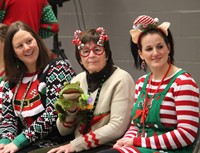 three teachers dressed festively