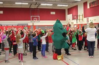 students and teachers dancing