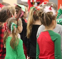 students with festive hair accessories