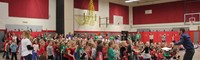 wide shot of students singing