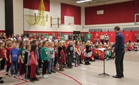 medium shot of students singing