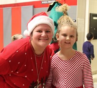 teacher and student dressed festively