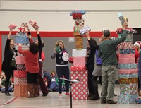 teachers participating in present stacking game