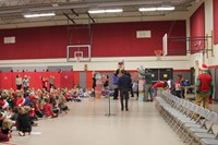 wide shot of teachers taking part in present stacking game