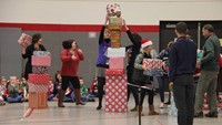 teachers taking part in present stacking game