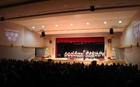 wide shot of band students performing Armed Forces Salute