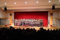 wide shot of students singing in chorus 