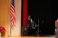 student playing drums