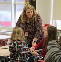 assistant superintendent speaking with students