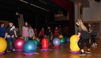 students taking part in drumming activity