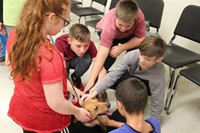 students petting dog