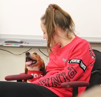 dog next to student