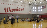 instructor explaining wheelchair activities to students