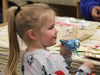 student holding new years party favors