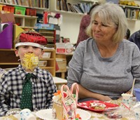 student and adult with new years party favors