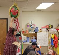 teacher pulling string for new years countdown