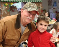 adult and student smiling