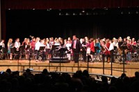 wide shot of band bowing after performance