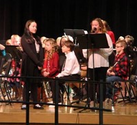 students speaking at winter concert