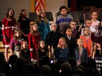 medium shot of students singing