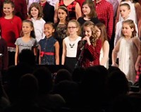 student speaking at winter concert