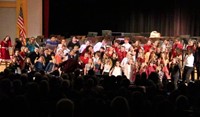 wide shot of students singing at winter concert