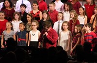 student speaking at winter concert