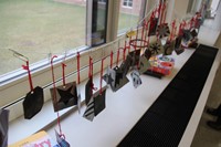 ornaments hanging on string in window sill