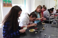 students working on copper plating ornaments