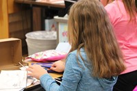 student sitting making habitat