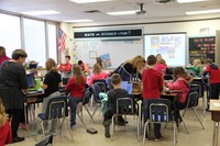 wide shot of classroom of students working on habitats