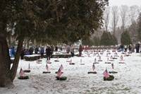 wide shot of cemetary and people standing